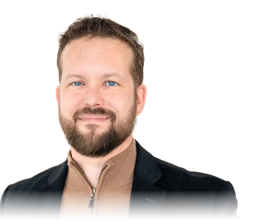Jason Harlton, smiling, in a dark blazer